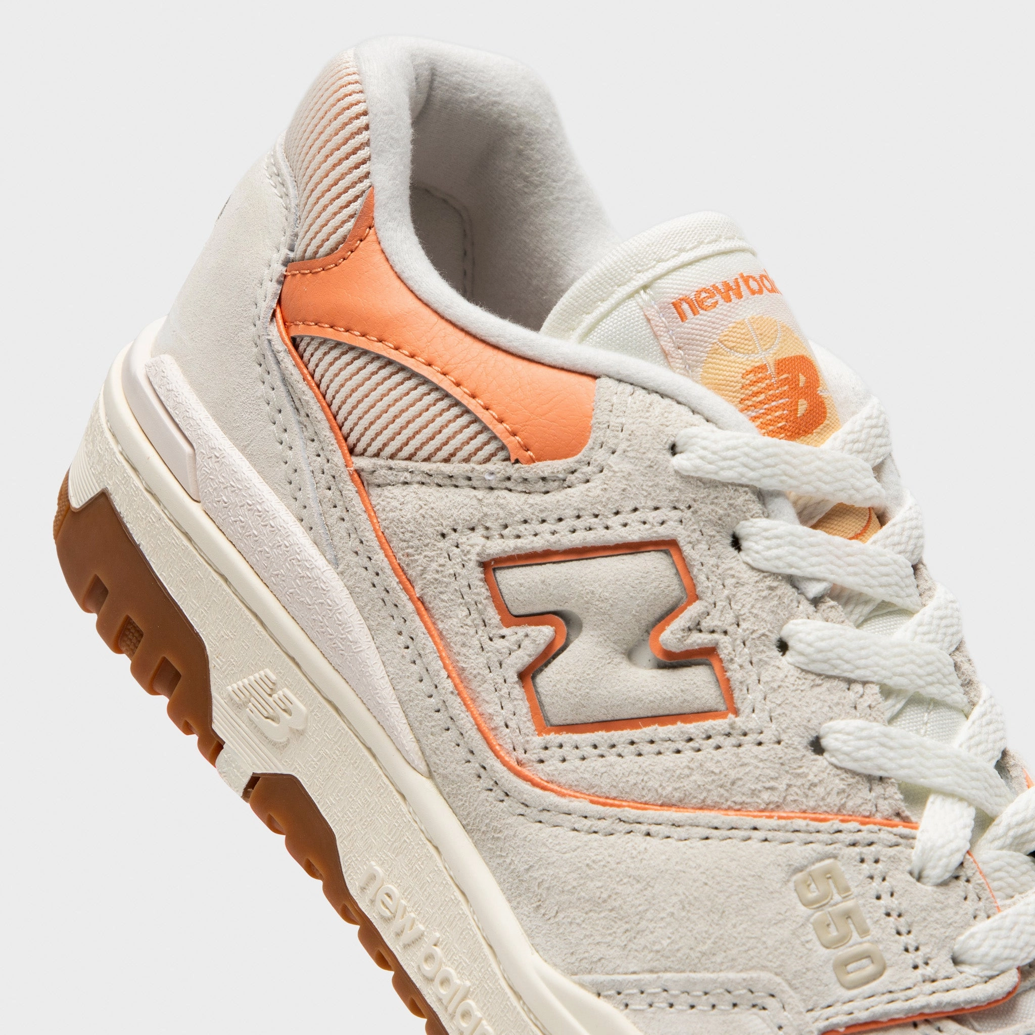 New Balance Women's 550 Sea Salt / Peach Nectar Play Driven Frame