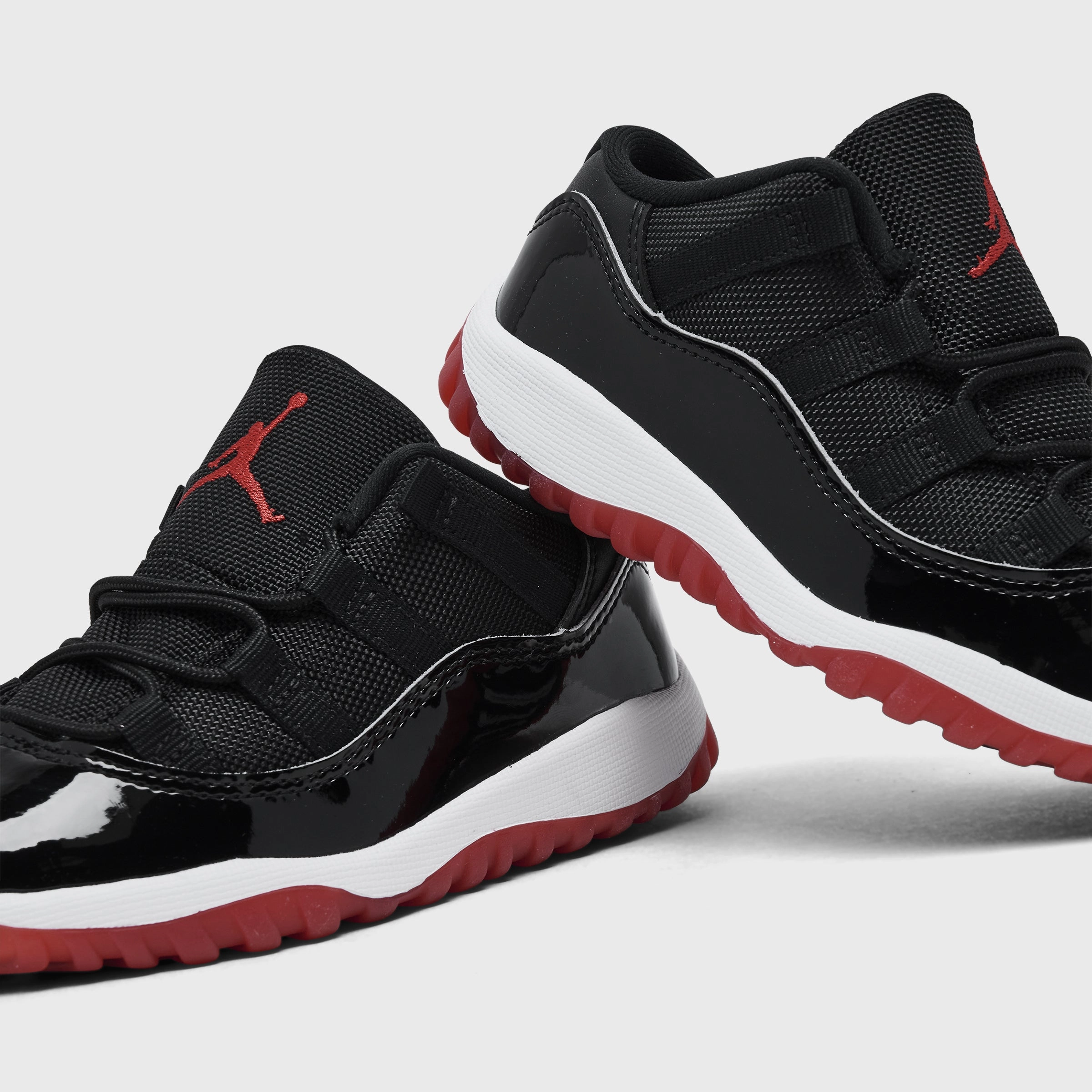 Jordan 11 Retro Low TD Black / Varsity Red - White Hyper Responsive Cushion