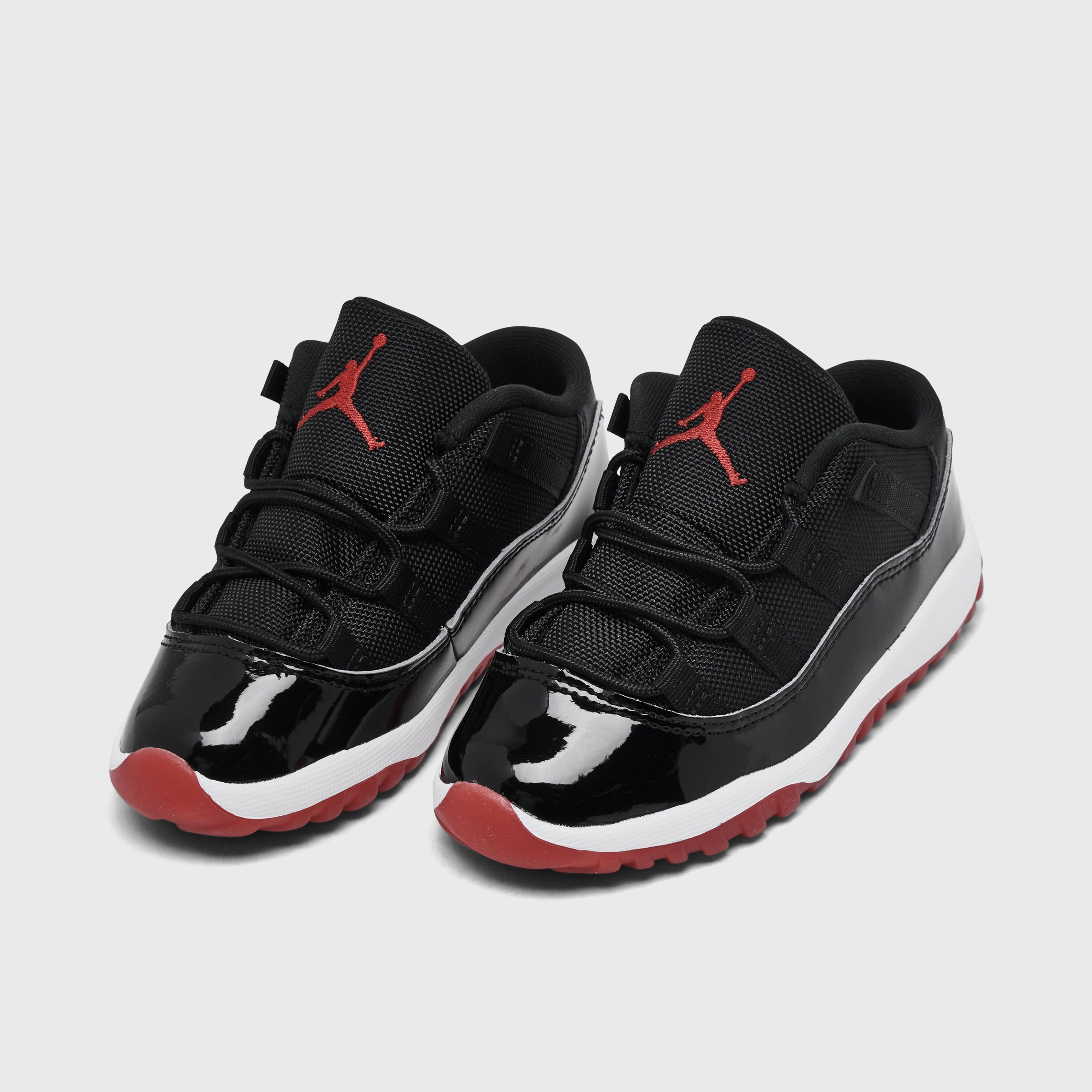 Jordan 11 Retro Low TD Black / Varsity Red - White Responsive Footbed