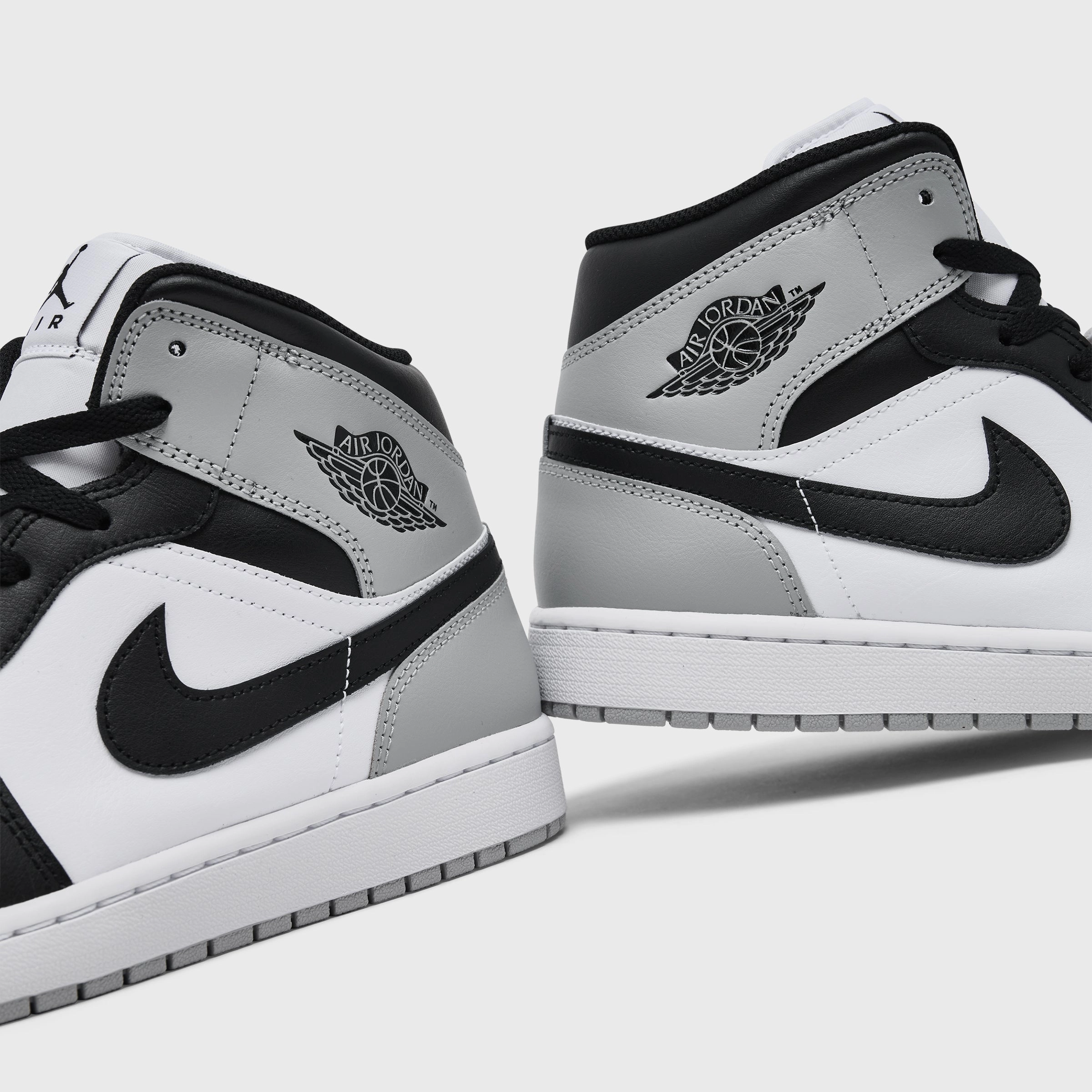 Jordan 1 Mid White / Black - Light Smoke Grey Street Spirit Engineered Knit Webbing